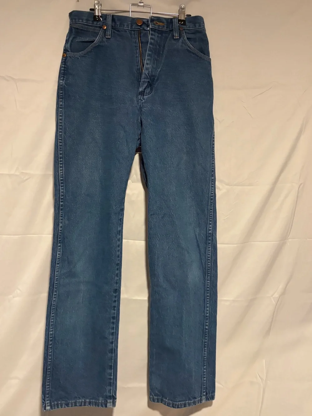 Wrangler Relaxed Fit Denim Jeans in Medium Blue with Orange Stitching
